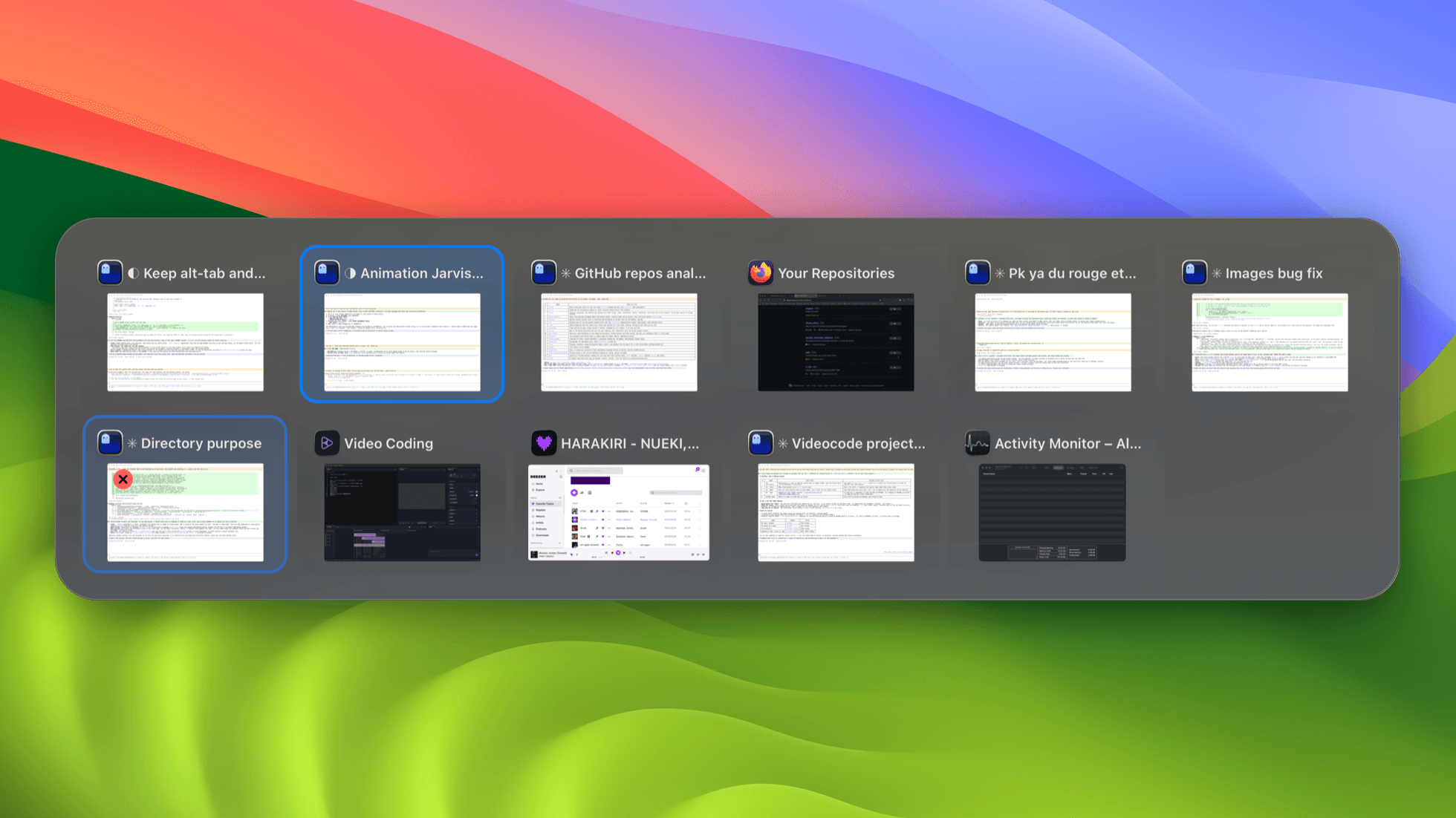 The switcher open over a desktop: eleven windows in two rows, the selected one outlined, the one under the pointer showing its close button